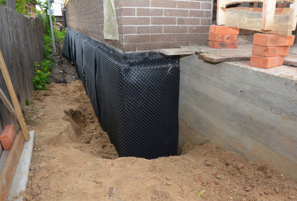 Happy homeowners after waterproofing job in Boyds